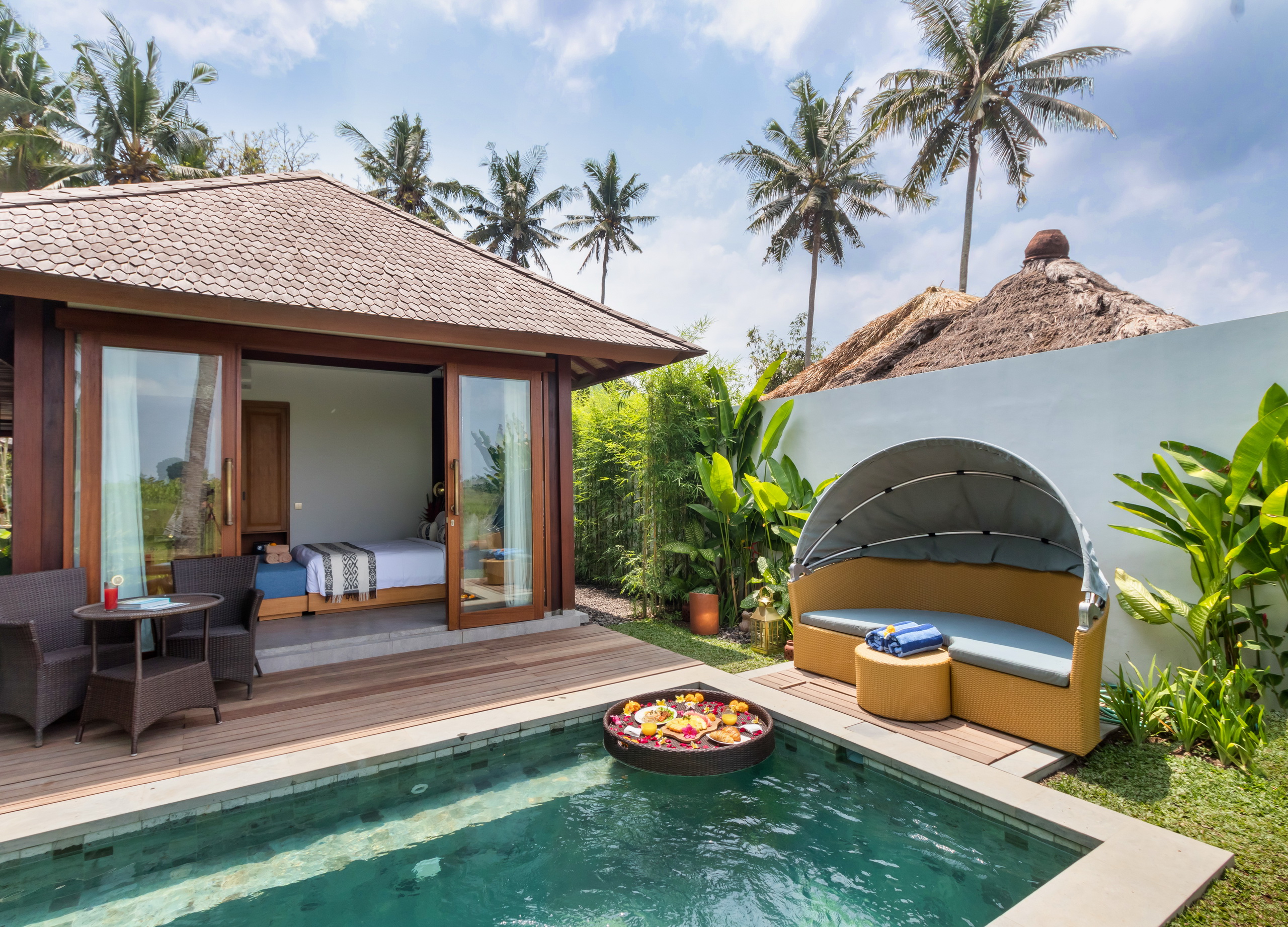 1 Exclusive Touchwood wooden villas overlooking a luxurious swimming pool in a tropical destination