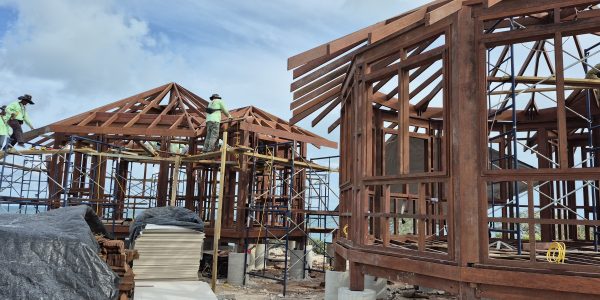 Timber structure in progress using sustainable Merbau wood, built on sandy shoreline