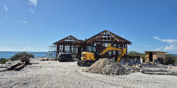 Early stage of villa construction with exposed Merbau beams, overlooking the ocean