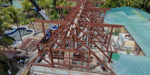 Ongoing Merbau roof installation by Touchwood crew in tropical Seychelles