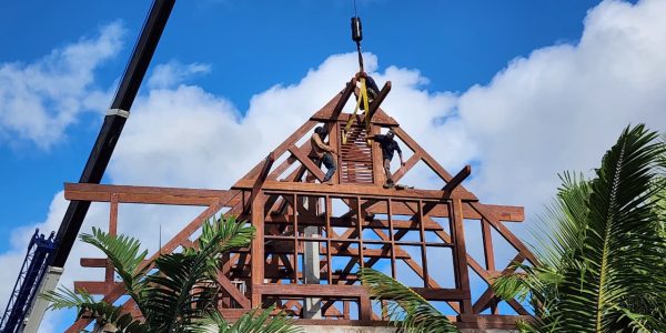 Skilled crew from Touchwood working on Merbau wood roof installation in Seychelles