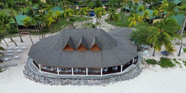 Corner view of the Merbau roof construction at Paradise Sun Hotel’s Main Restaurant in Seychelles, emphasizing durability and luxury design