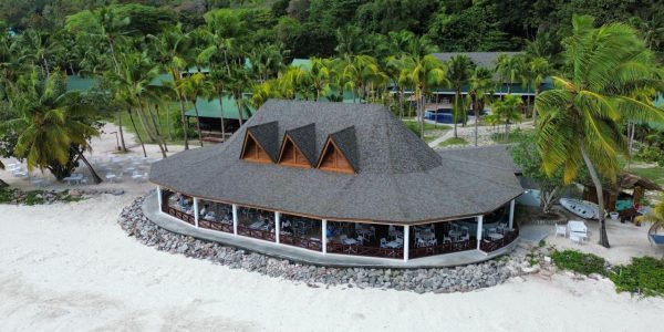 Side angle of the completed Merbau roof structure of the Main Restaurant, Paradise Sun Hotel, showing natural hardwood details and craftsmanship
