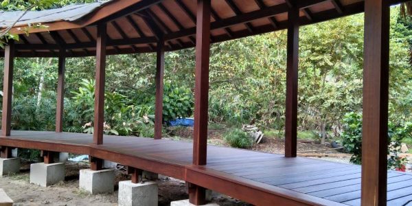 Aerial angle of tropical resort villa construction showing roof geometry and integration with Fiji landscape