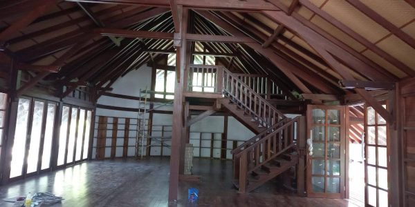Interior view of prefabricated timber framing and structural installation inside tropical villa in Fiji